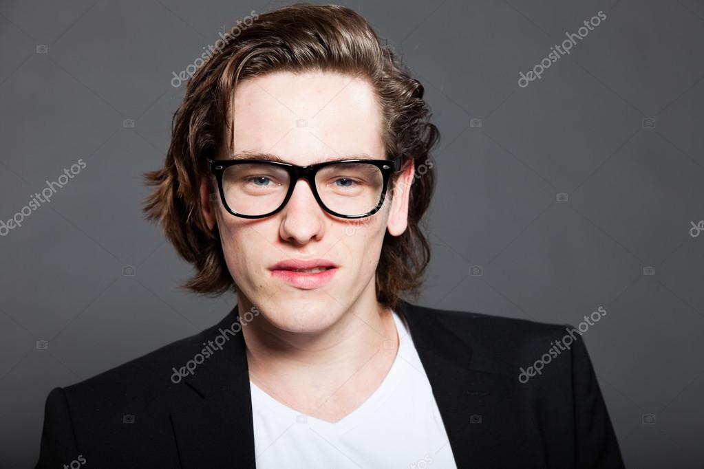blue-jacket-and-retro-glasses-isolated-on-grey-background.-Fashion-studio-shot.-Expressive-face..jpg